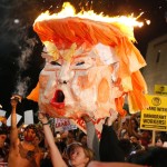 protestors set trump effigy on fire